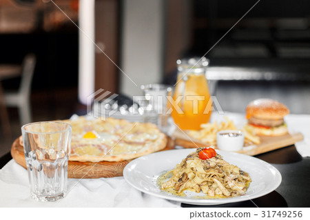 beautiful table of italian pasta, pizza, burger beautiful table of italian pasta, pizza, burger 31749256