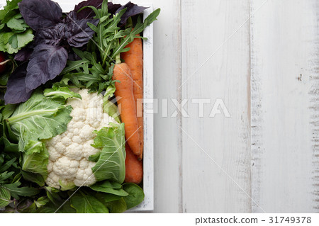 Fresh vegetables and herbs in wooden box 31749378