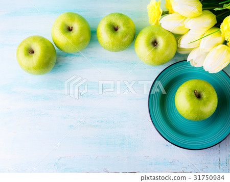 Green pastel background with apples. Healthy food Green pastel background with apples. Healthy food 31750984