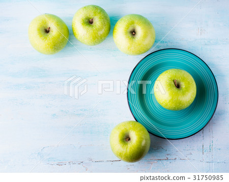 Green pastel background with apples. Healthy food Green pastel background with apples. Healthy food 31750985