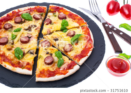 Homemade pizza on black stone plate 31751610