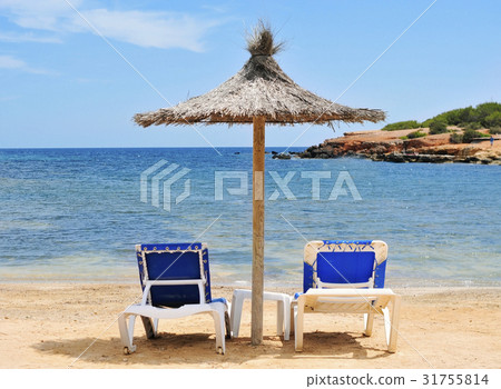 umbrella and sunloungers in Ibiza, Spain 31755814