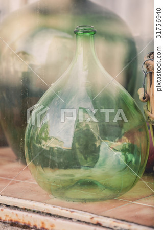 Old empty wine bottles behind the glass 31756940