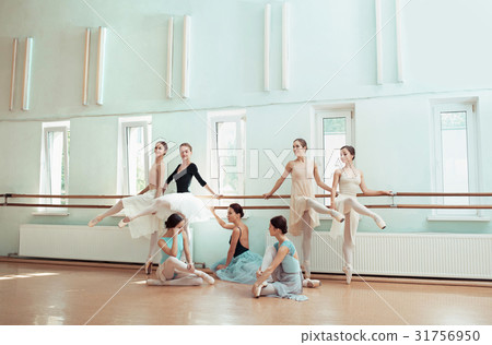 The seven ballerinas at ballet bar The seven ballerinas at ballet bar 31756950
