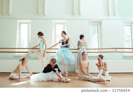 The seven ballerinas at ballet bar 31756954