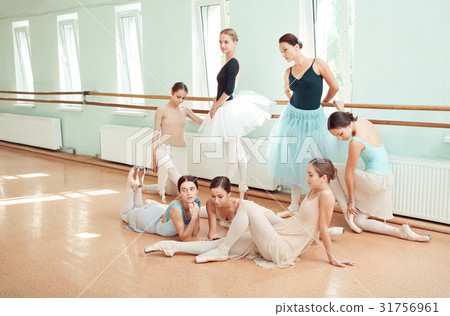The seven ballerinas at ballet bar 31756961