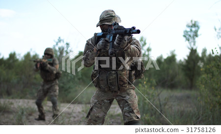 Soldiers aiming on battlefield 31758126