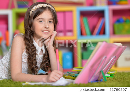 cute girl doing homework 31760207
