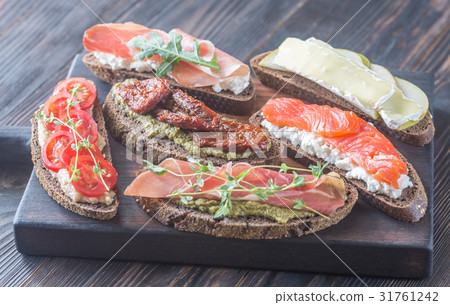 Crostini with different toppings Crostini with different toppings 31761242