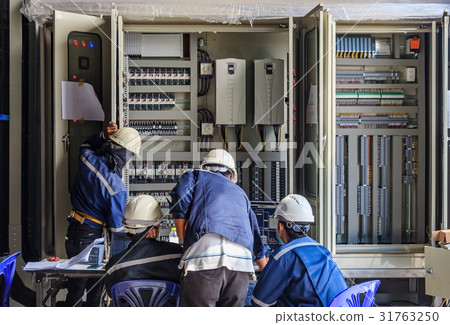 Engineer working on checking status transformer Engineer working on checking status transformer 31763250
