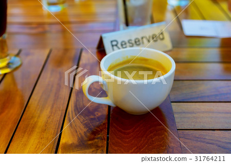 cup of coffee on table in coffee shop cafe cup of coffee on table in coffee shop cafe 31764211