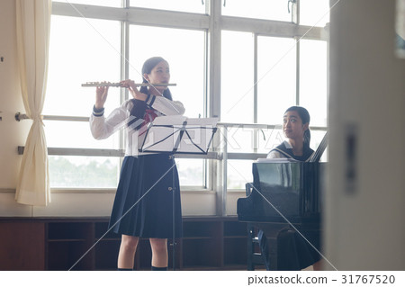School girls practicing flutes 31767520