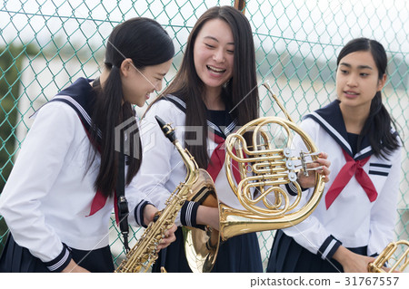 School girls who practice musical instruments on the rooftop 31767557