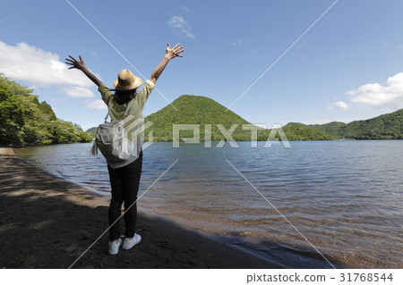 A young woman looking at Lake Haruna A young woman looking at Lake Haruna 31768544