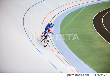 Racing cyclist on velodrome outdoor. 31769473