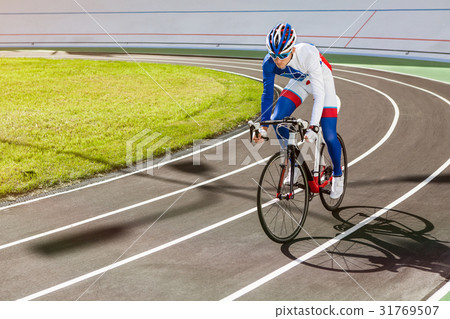 Racing cyclist on velodrome outdoor. 31769507