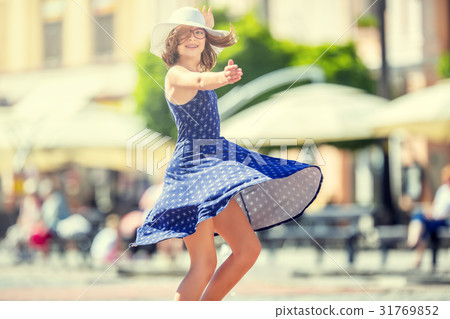 Cute happy girl in summer outfit dancing. Cute happy girl in summer outfit dancing. 31769852