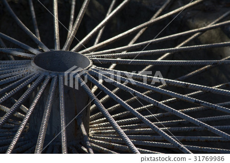 Decorative grid of rebar in the shape of a wheel. 31769986