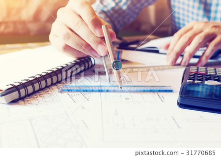 Architect man drawing geometric shape on blueprint Architect man drawing geometric shape on blueprint 31770685