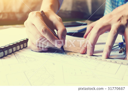 Architect man drawing geometric shape on sheet Architect man drawing geometric shape on sheet 31770687