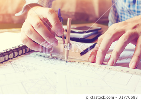 Architect man working with drawing compass 31770688
