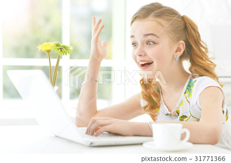 Little girl with modern laptop 31771366