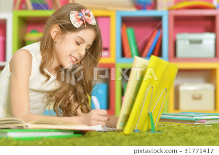 cute girl doing homework cute girl doing homework 31771417