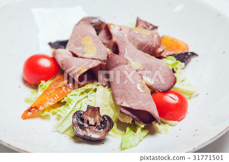 Salad with thin pieces of meat, mushrooms and 31771501