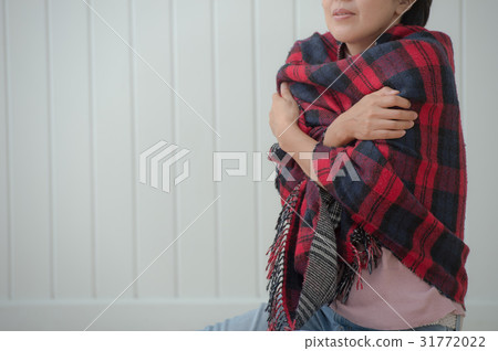 A cold woman feels cold 31772022