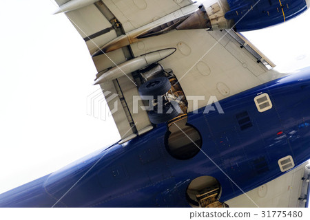 The underside of a modern airplane with its flaps The underside of a modern airplane with its flaps 31775480