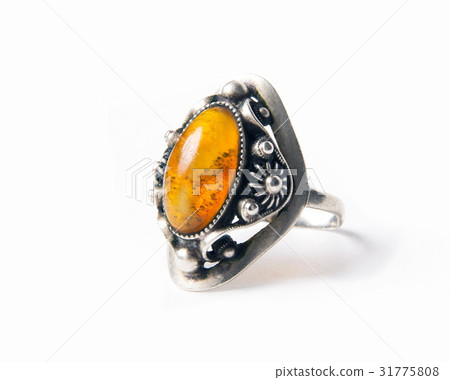 Vintage amber ring on white 31775808
