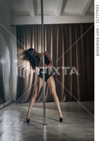 Girl pole dancer on training. Girl pole dancer on training. 31777433
