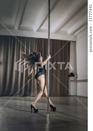 Girl pole dancer on training.  31777442