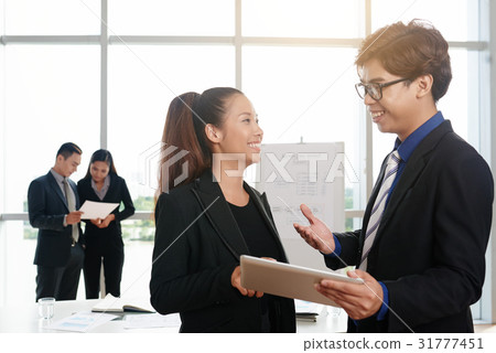 Cheerful Colleagues at Work Cheerful Colleagues at Work 31777451