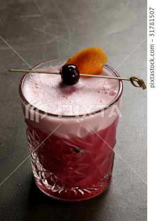 Cocktail with cherry on a skewer. Close up Cocktail with cherry on a skewer. Close up 31781507
