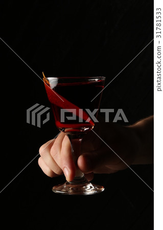 Glass of red moon in the hands. Close up Glass of red moon in the hands. Close up 31781533