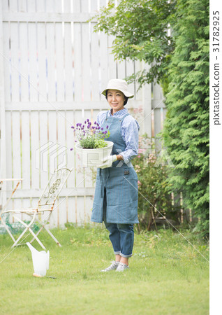 A woman enjoying gardening A woman enjoying gardening 31782925