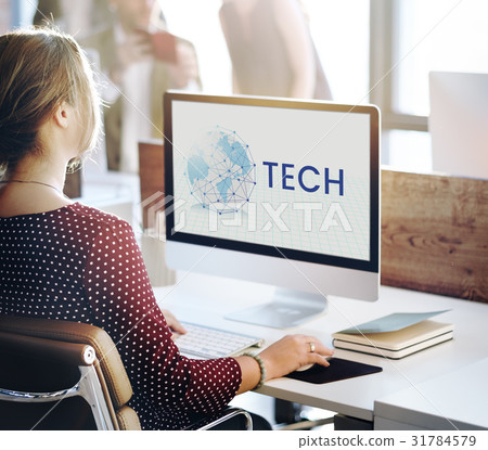 Woman working on computer network graphic overlay 31784579