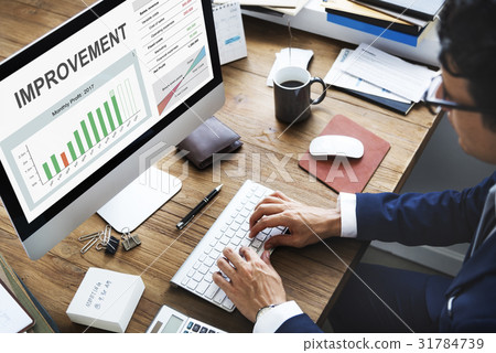 Man working on computer network graphic overlay 31784739