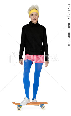 Trendy Woman Standing on a Skateboard Trendy Woman Standing on a Skateboard 31785794