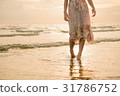 Happy asia woman Enjoying Beautiful Sunset  Beach 31786752