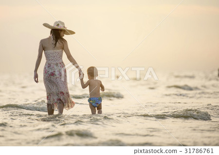 Family fun in sea beach surf Happy mother son Family fun in sea beach surf Happy mother son 31786761