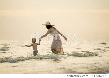 Family fun in sea beach surf Happy mother son Family fun in sea beach surf Happy mother son 31786763