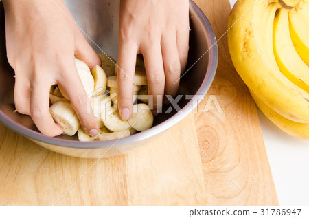 Ripe banana mashed by hand in a bowl Ripe banana mashed by hand in a bowl 31786947
