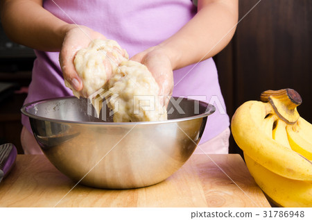 Ripe banana mashed by hand in a bowl Ripe banana mashed by hand in a bowl 31786948