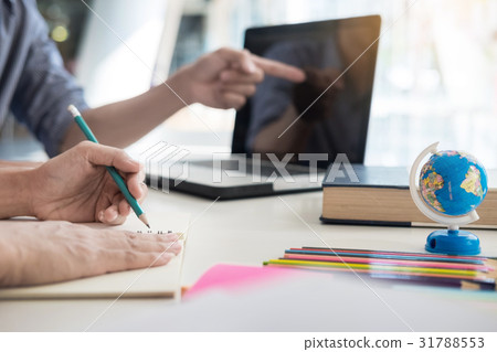 Young woman and man studying for a test/ an exam. Young woman and man studying for a test/ an exam. 31788553
