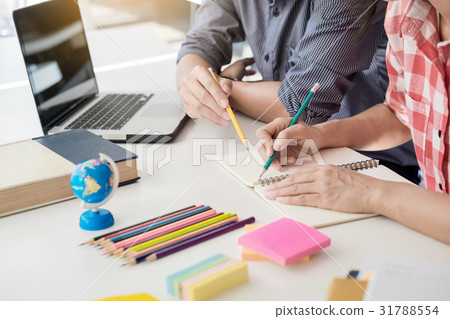 Young woman and man studying for a test/ an exam 31788554