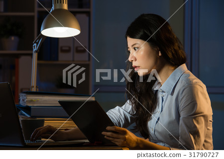 business woman use digital tablet working late business woman use digital tablet working late 31790727