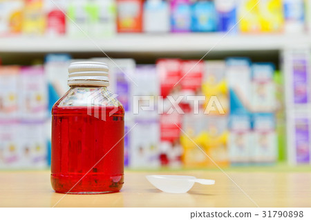 Red cough and cold liquid medicine 31790898