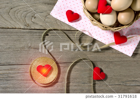 golden ribbon with egg and heart-shaped 31791618
